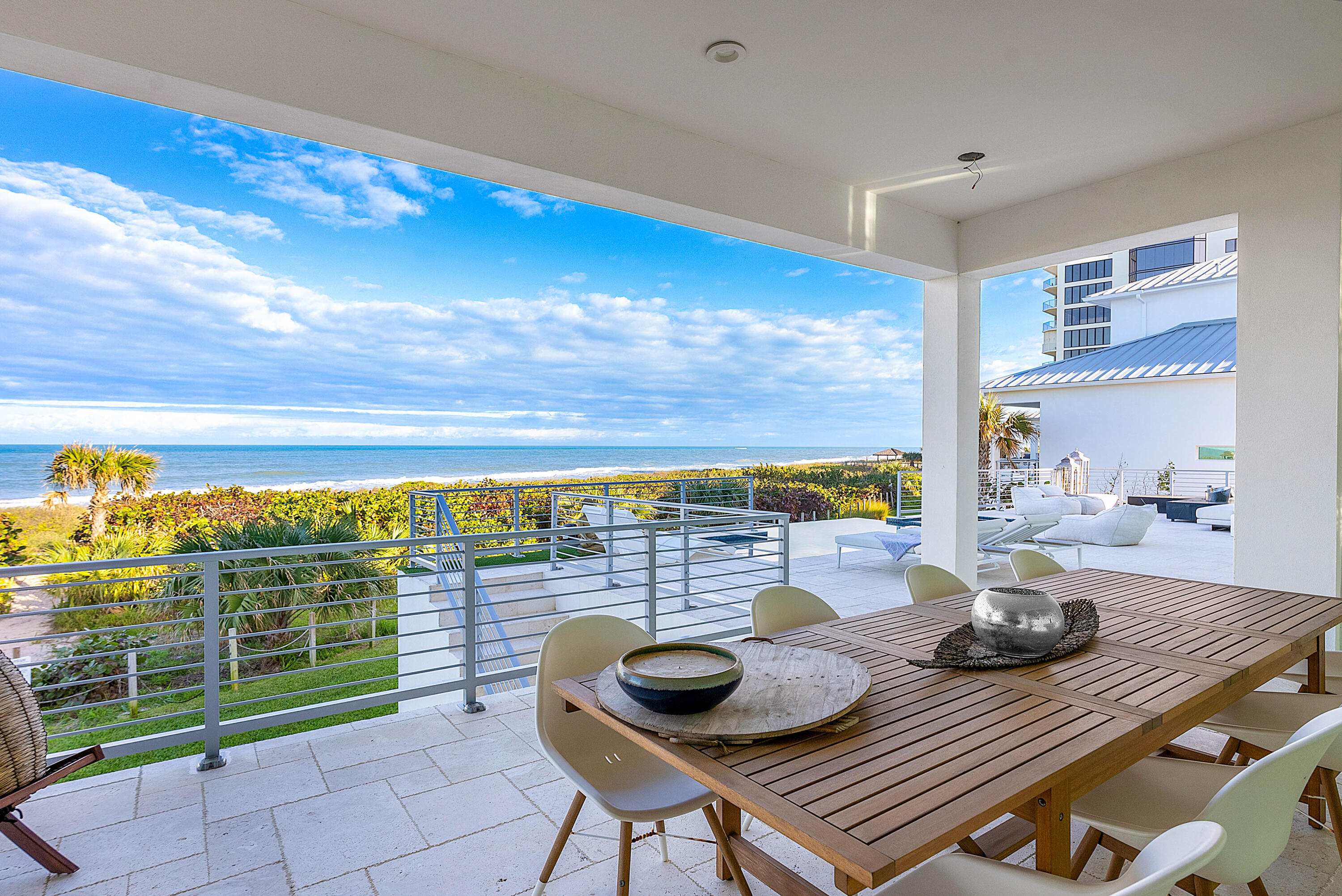 4422 North Hwy A1A Hutchinson Island, FL 34949 - Photo 50 of 86 a view of a dining room with furniture one side and wooden floor