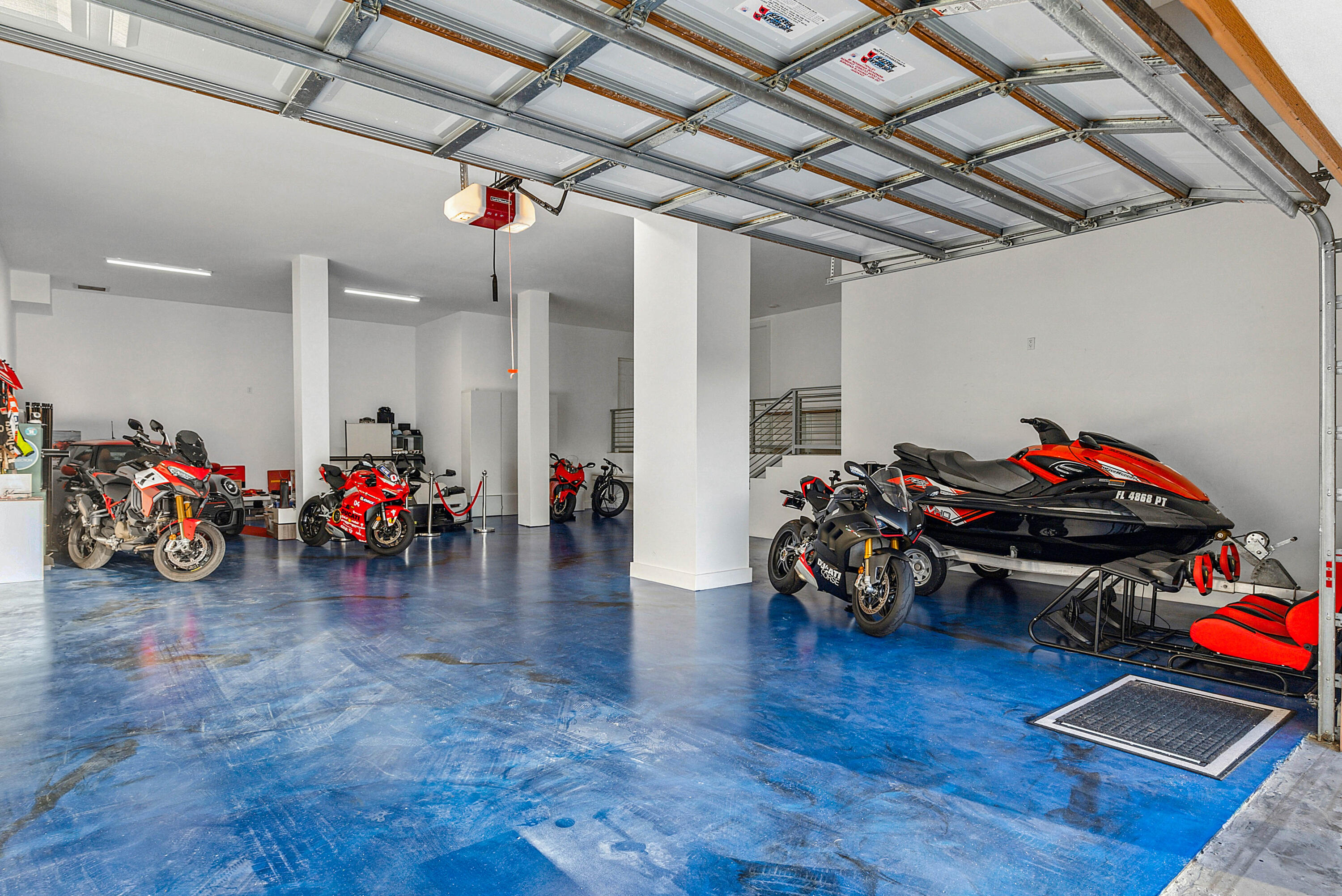 4422 North Hwy A1A Hutchinson Island, FL 34949 - Photo 59 of 86 a garage with furniture and a table