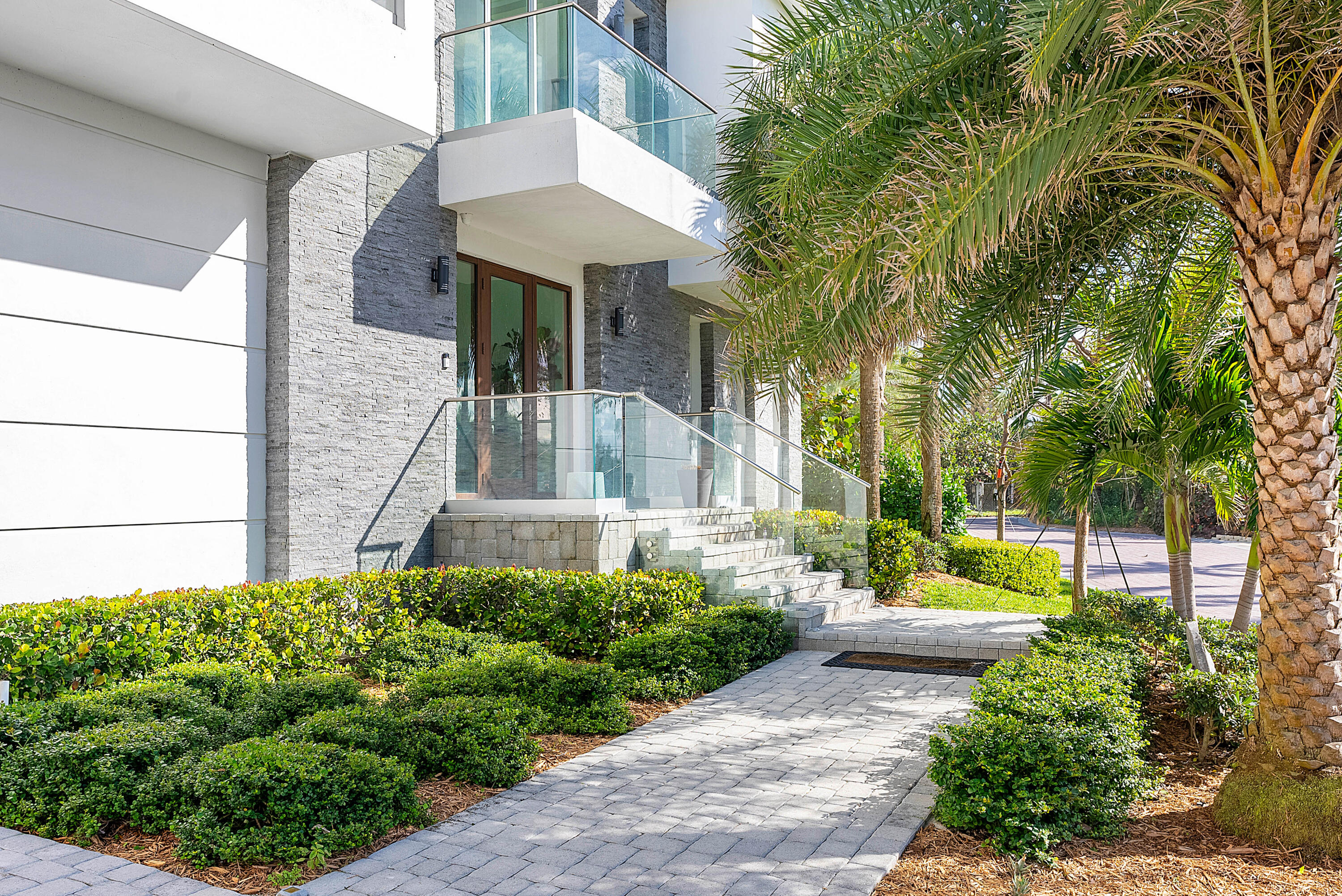 4422 North Hwy A1A Hutchinson Island, FL 34949 - Photo 6 of 86 a front view of a house with garden