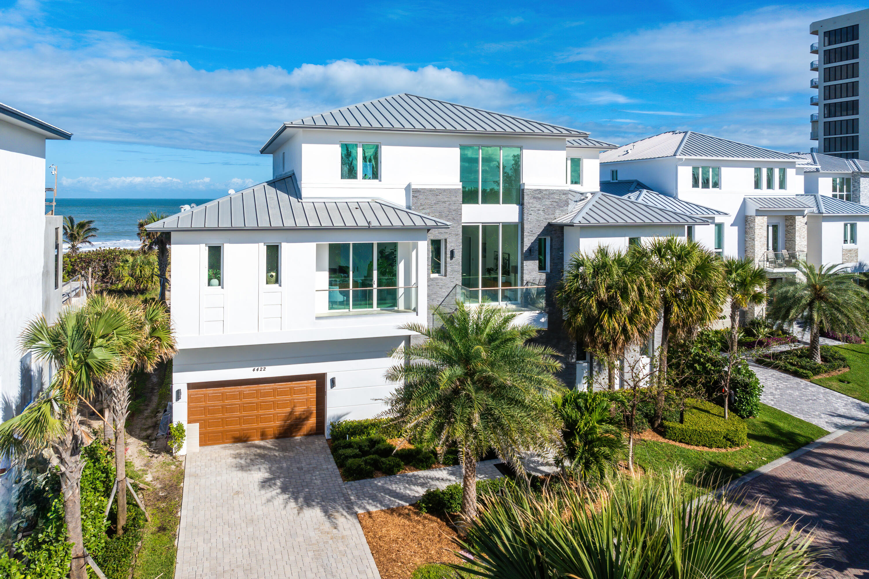 4422 North Hwy A1A Hutchinson Island, FL 34949 - Photo 61 of 86 a front view of a house with a yard
