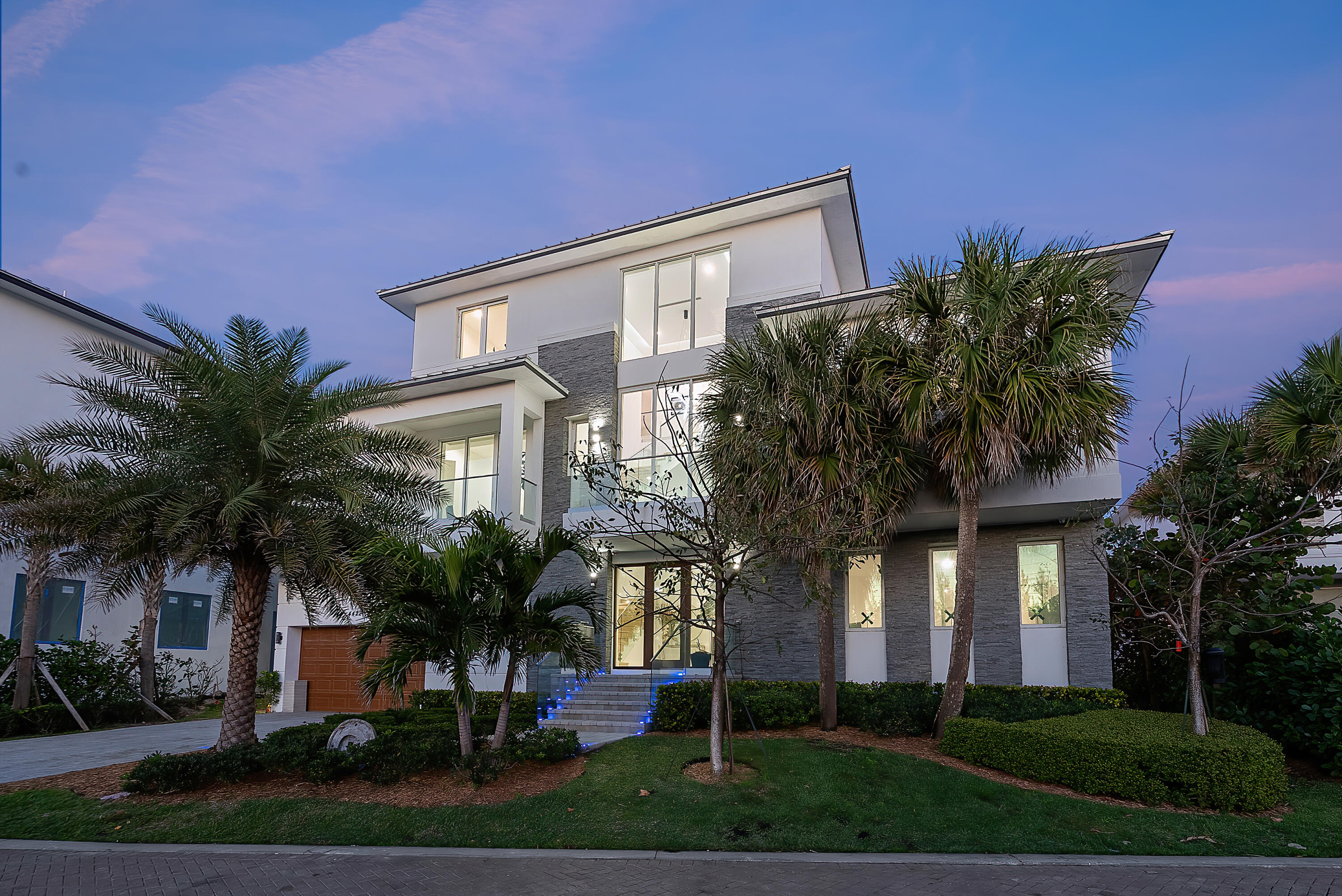 4422 North Hwy A1A Hutchinson Island, FL 34949 - Photo 73 of 86 a front view of a house with a garden
