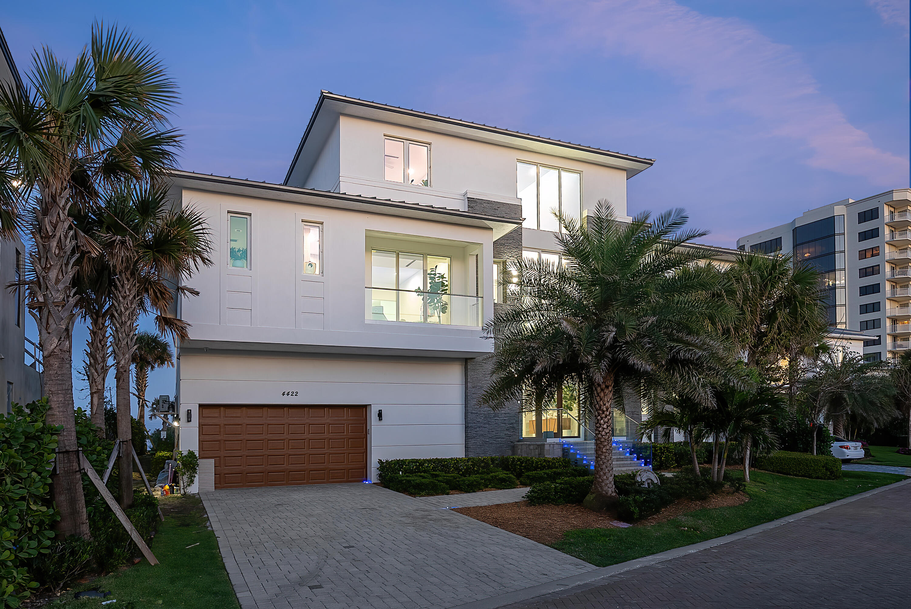 4422 North Hwy A1A Hutchinson Island, FL 34949 - Photo 74 of 86 a front view of a house with a garden