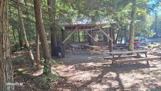 a front view of a house with yard porch and furniture