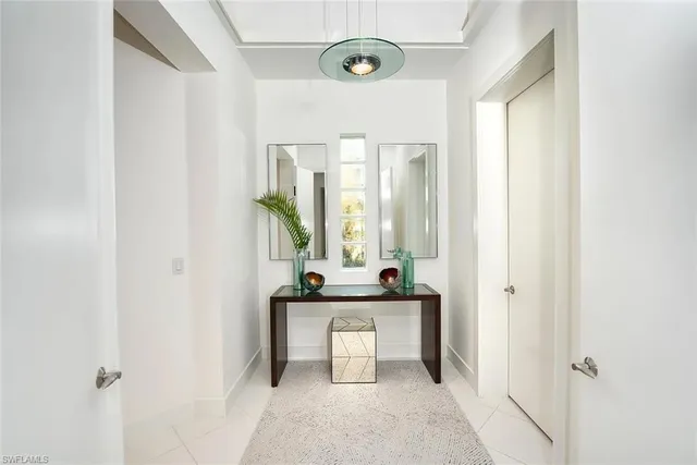a bathroom with a granite countertop sink mirror and toilet