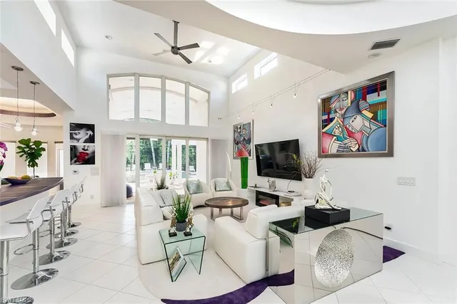a large kitchen with lots of counter space and windows