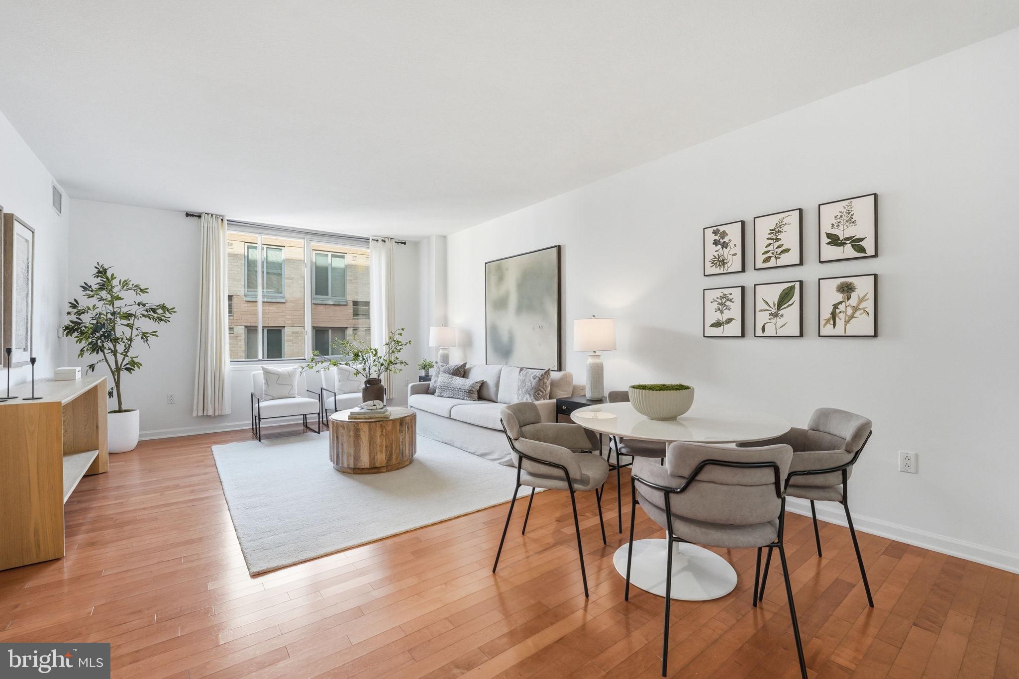 440 L Street Northwest, Unit 809 Washington, DC 20001 - Photo 11 of 50 a living room with furniture and wooden floor