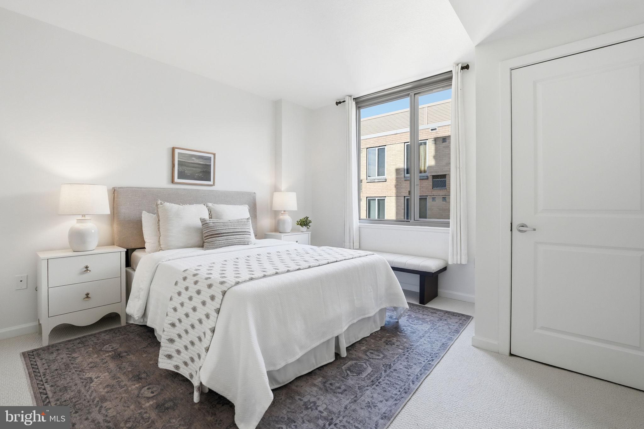 440 L Street Northwest, Unit 809 Washington, DC 20001 - Photo 16 of 50 a bedroom with a bed and window