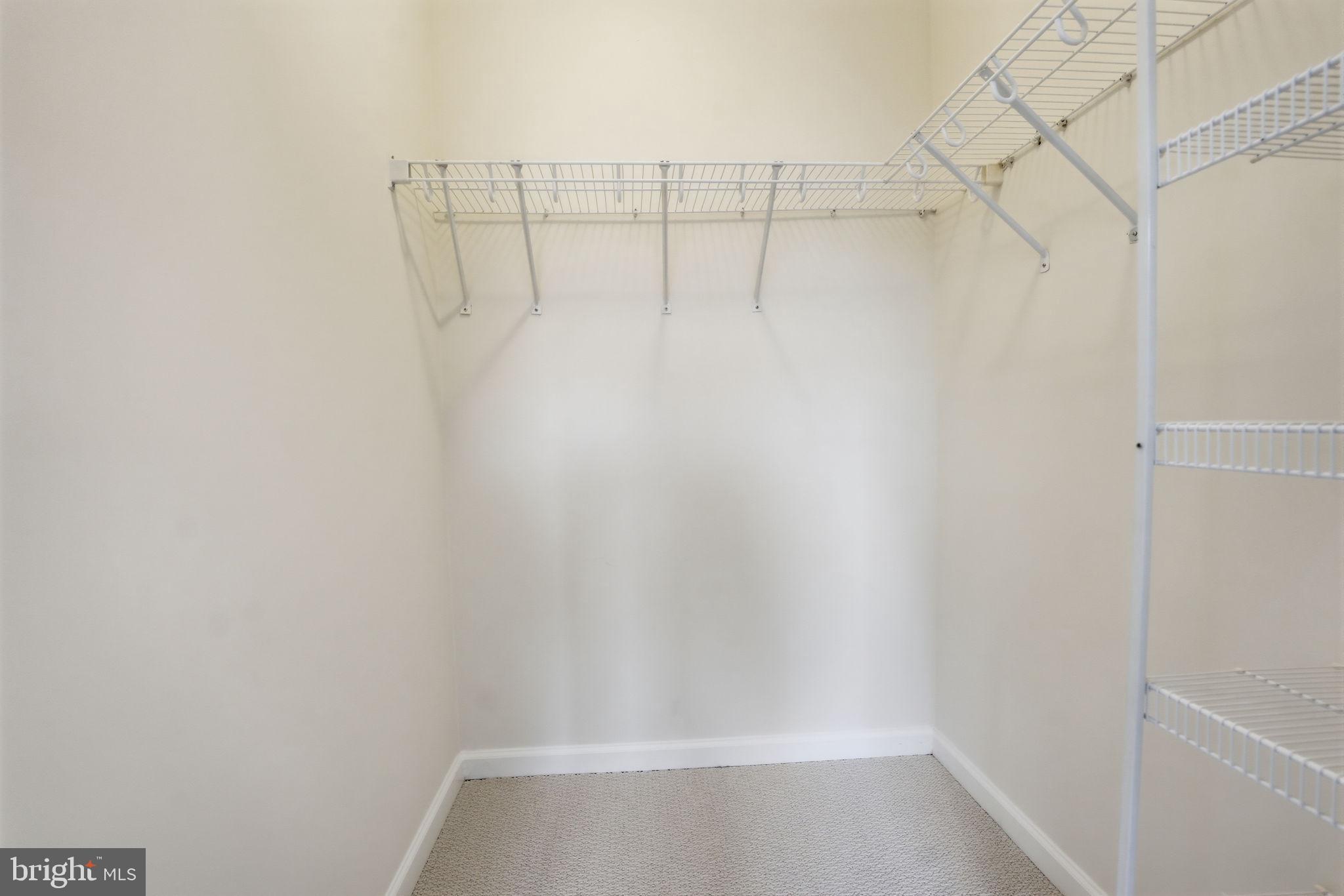 440 L Street Northwest, Unit 809 Washington, DC 20001 - Photo 19 of 50 a view of a room with racks on the wall