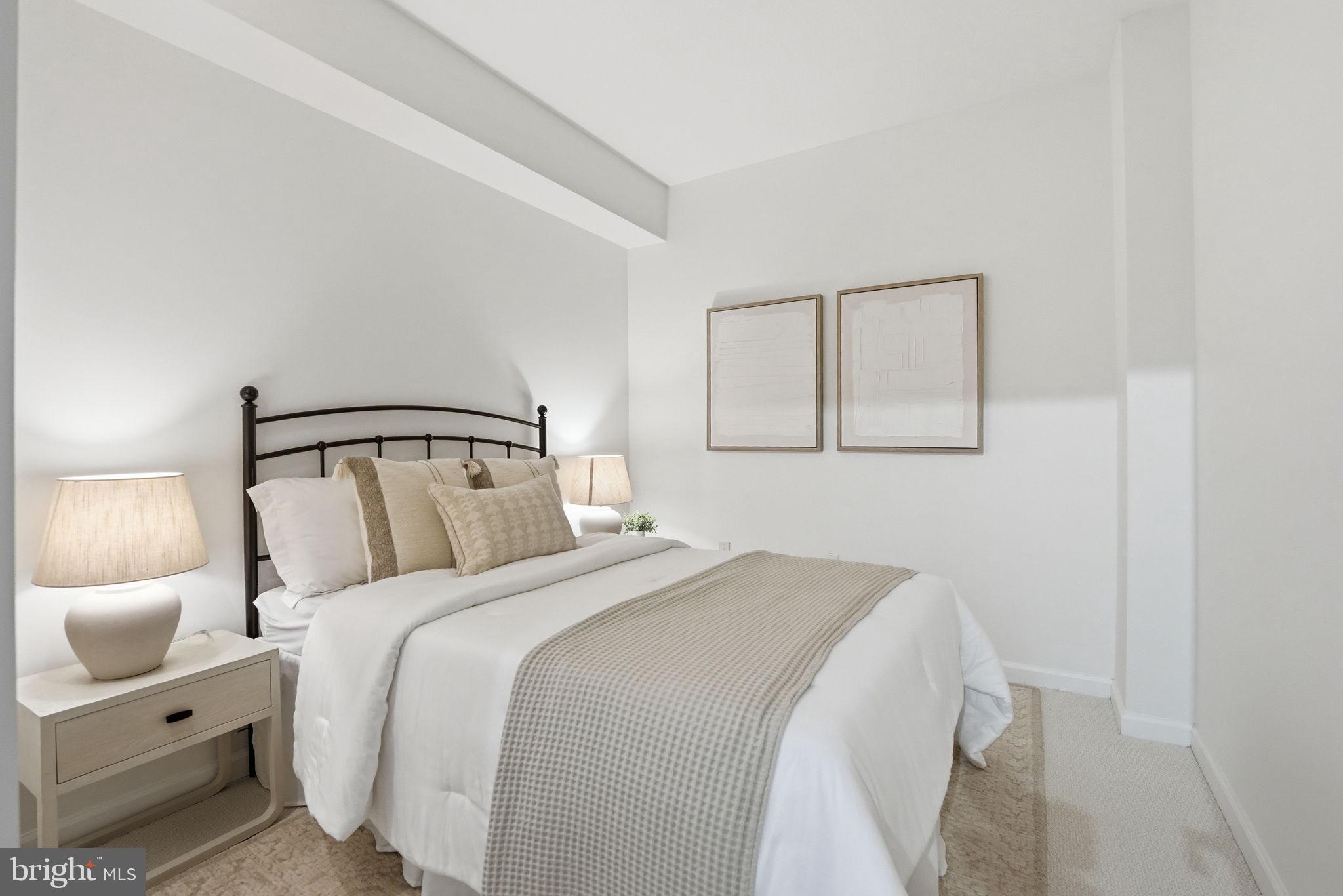 440 L Street Northwest, Unit 809 Washington, DC 20001 - Photo 20 of 50 a bedroom with a bed and a mirror