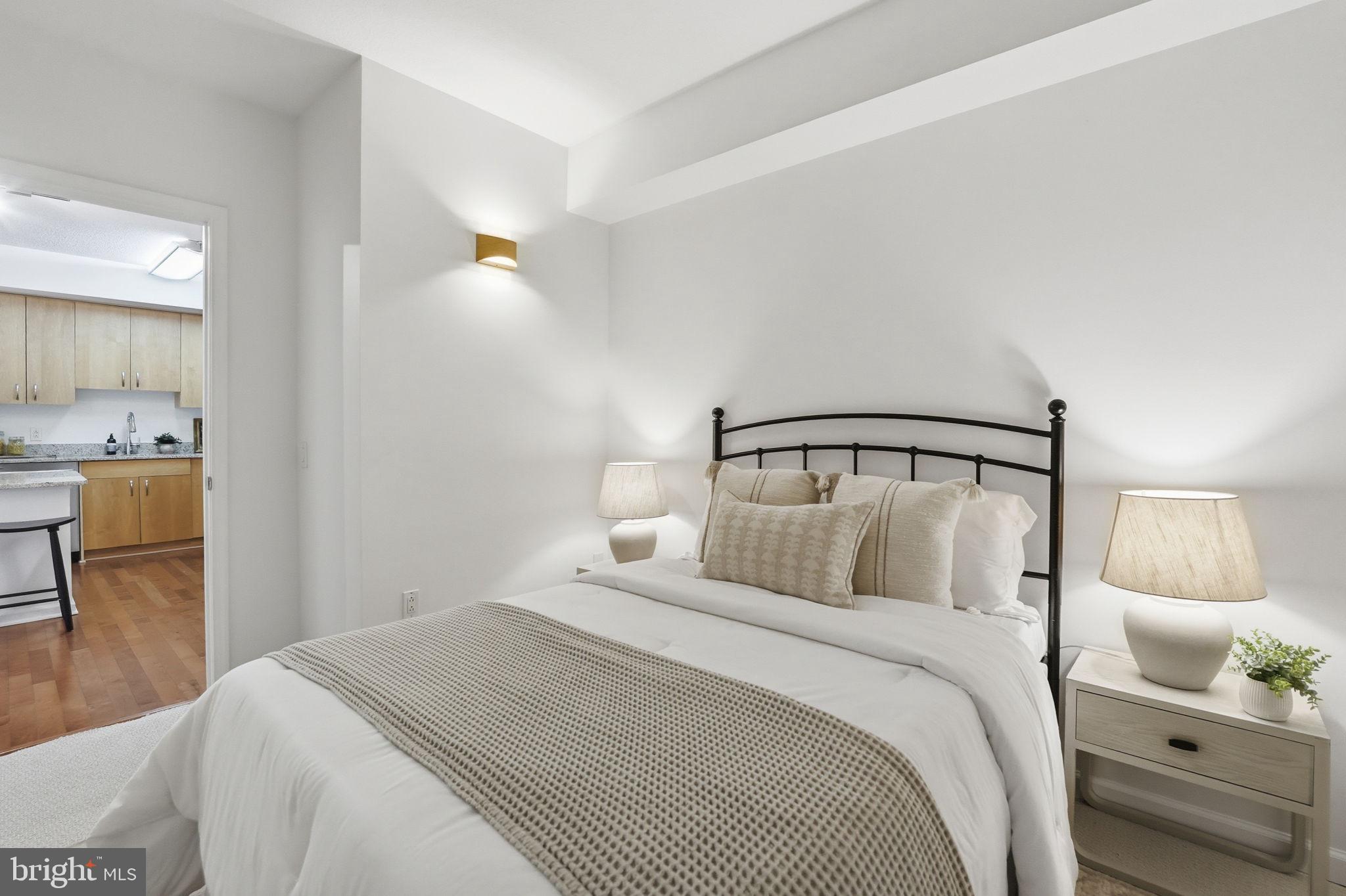 440 L Street Northwest, Unit 809 Washington, DC 20001 - Photo 21 of 50 a bedroom with a bed and chair