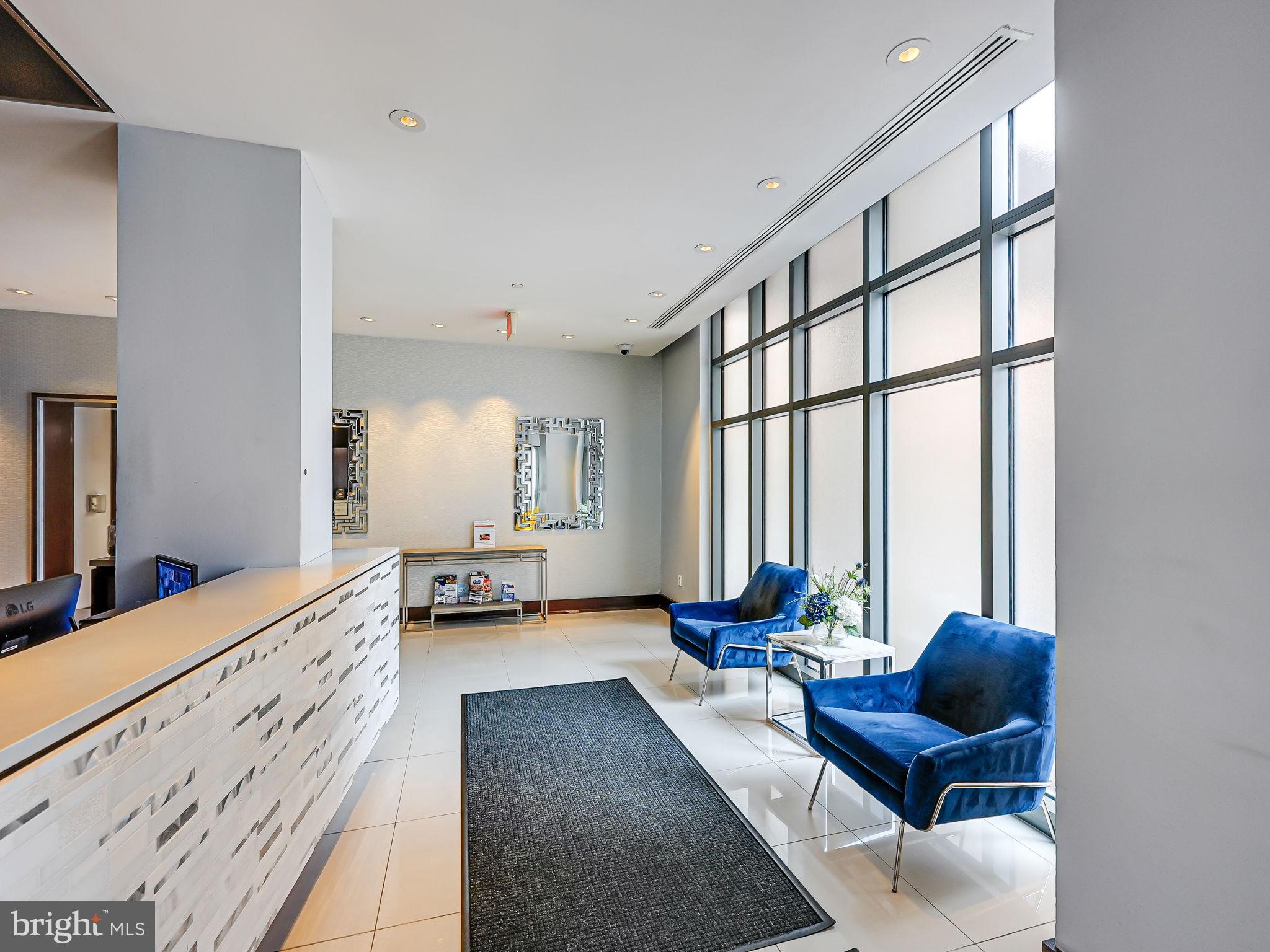 440 L Street Northwest, Unit 809 Washington, DC 20001 - Photo 25 of 50 a living room with furniture and large windows