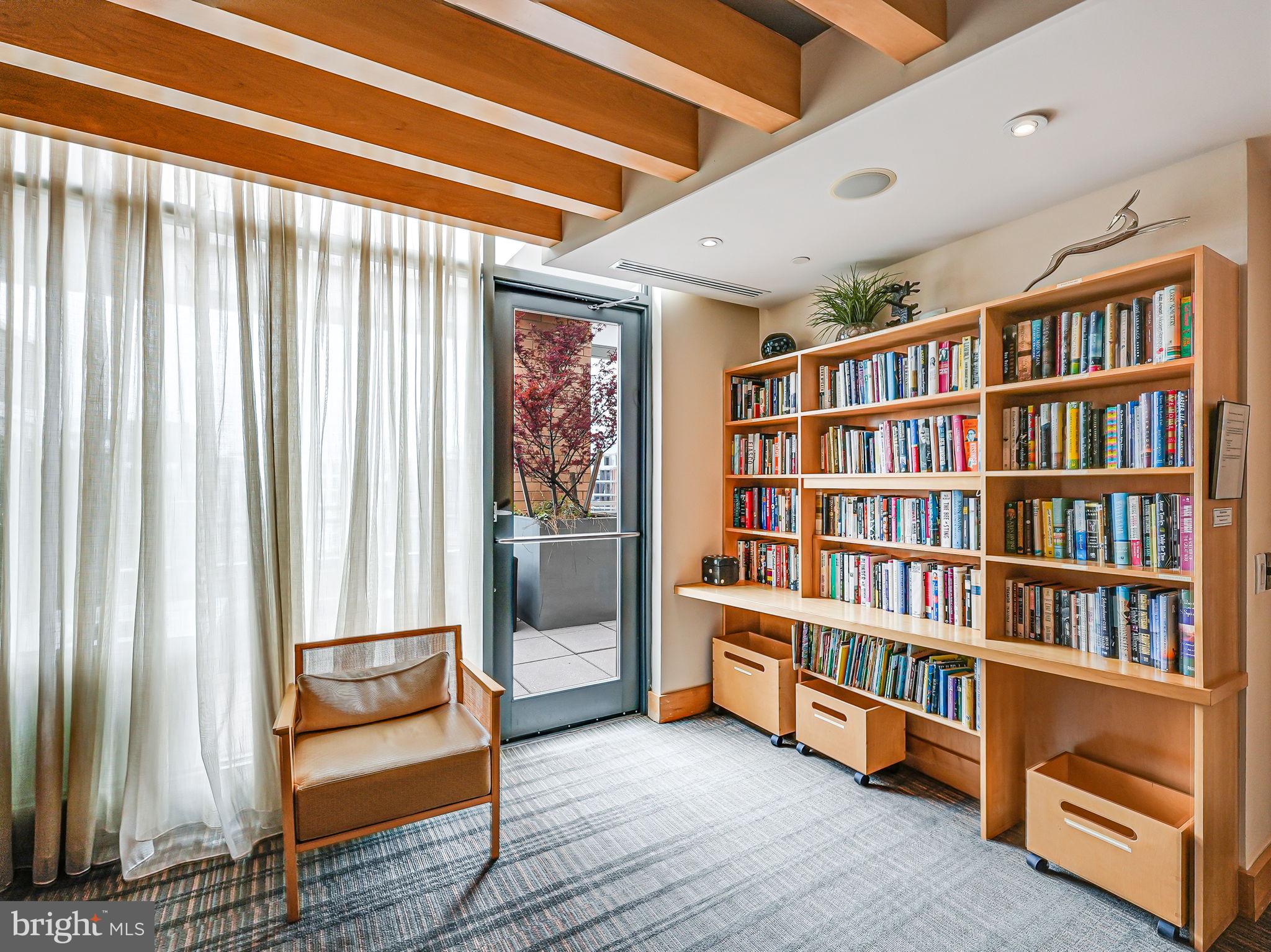 440 L Street Northwest, Unit 809 Washington, DC 20001 - Photo 31 of 50 a living room with furniture and a book shelf
