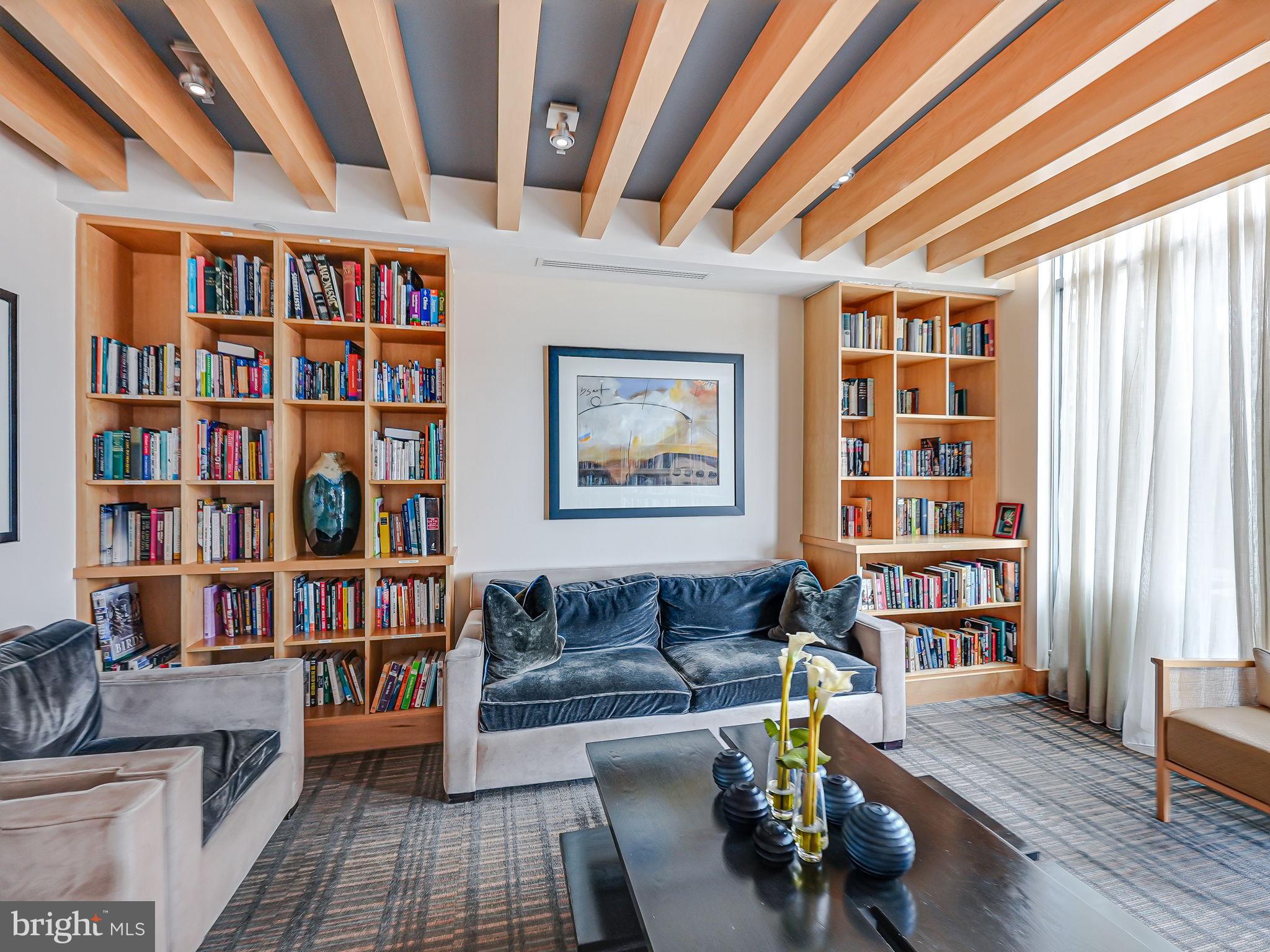 440 L Street Northwest, Unit 809 Washington, DC 20001 - Photo 32 of 50 a living room with furniture and a book shelf
