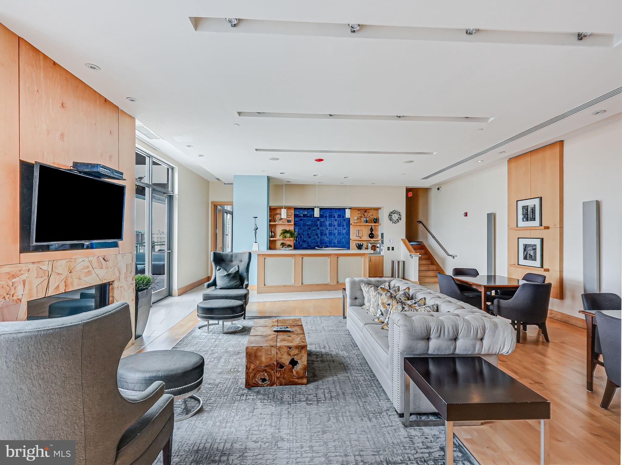 440 L Street Northwest, Unit 809 Washington, DC 20001 - Photo 33 of 50 a living room with furniture and a flat screen tv