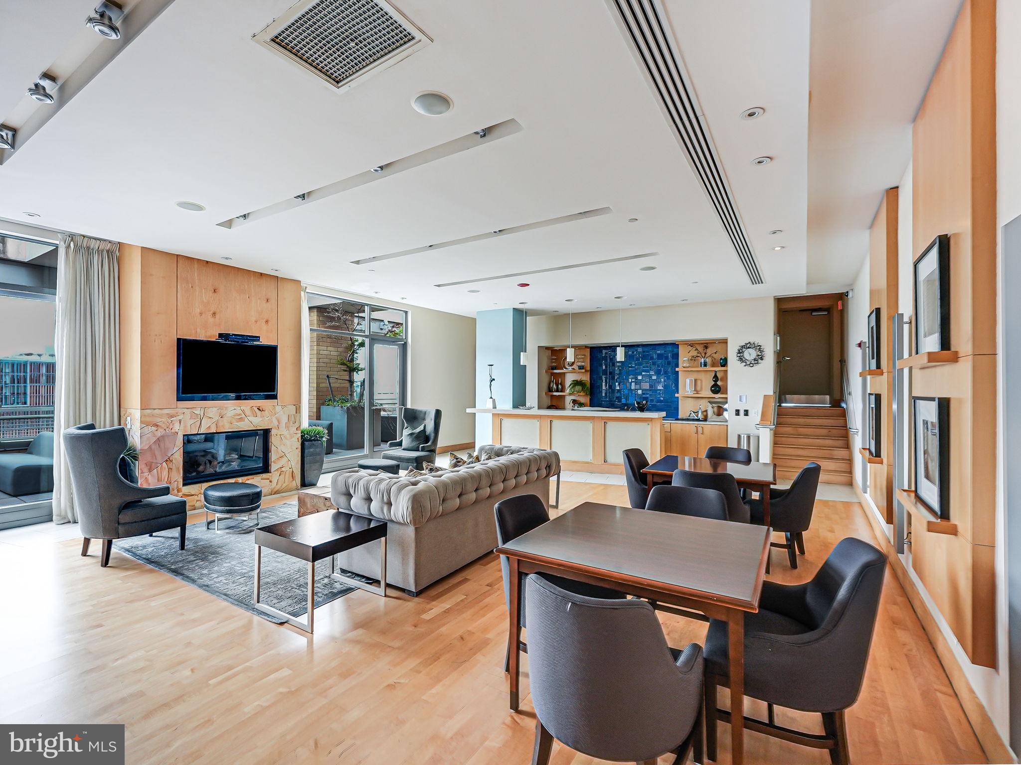 440 L Street Northwest, Unit 809 Washington, DC 20001 - Photo 34 of 50 a living room with furniture a flat screen tv and a large window