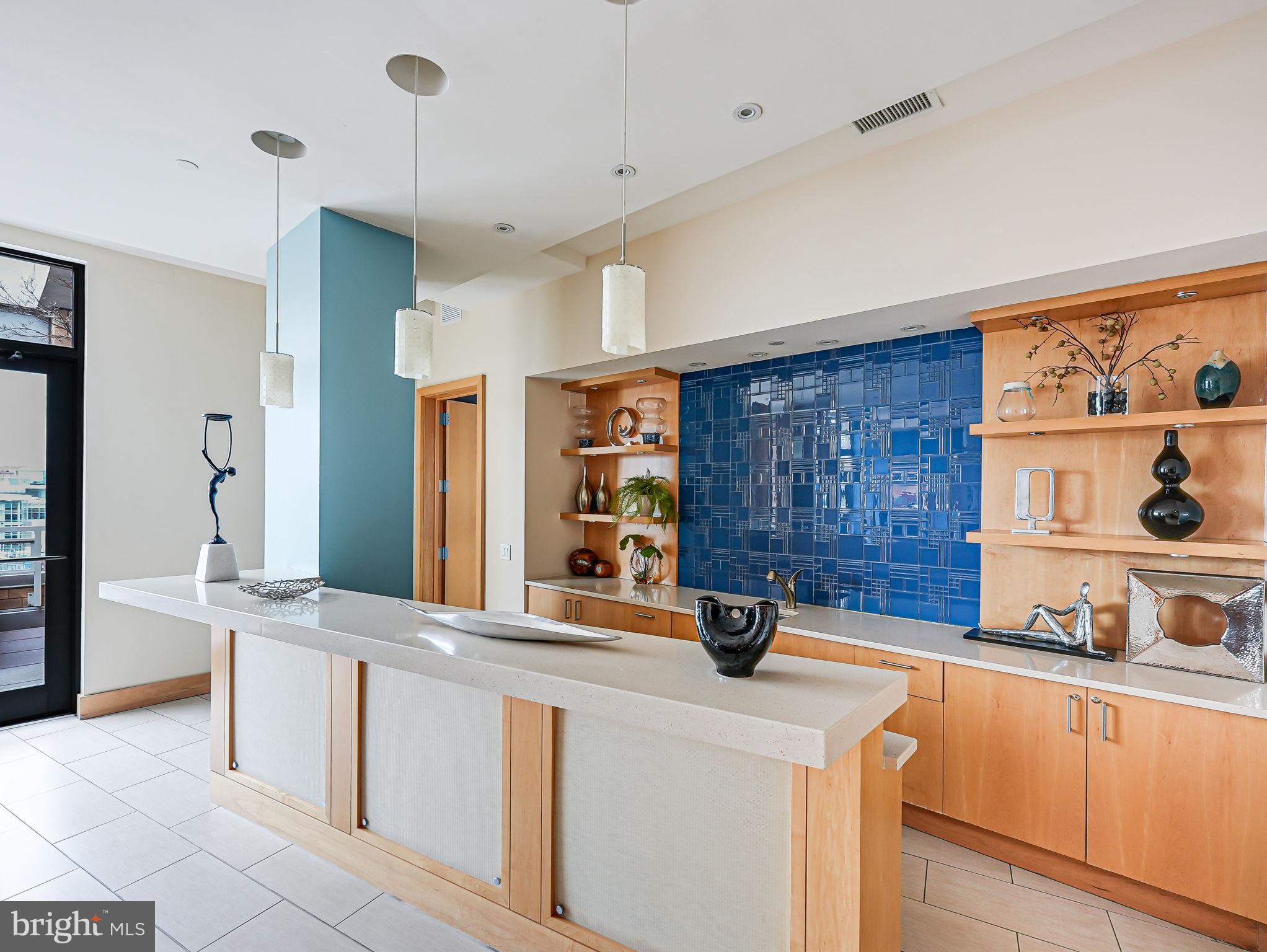 440 L Street Northwest, Unit 809 Washington, DC 20001 - Photo 35 of 50 a kitchen with stainless steel appliances granite countertop a sink and cabinets