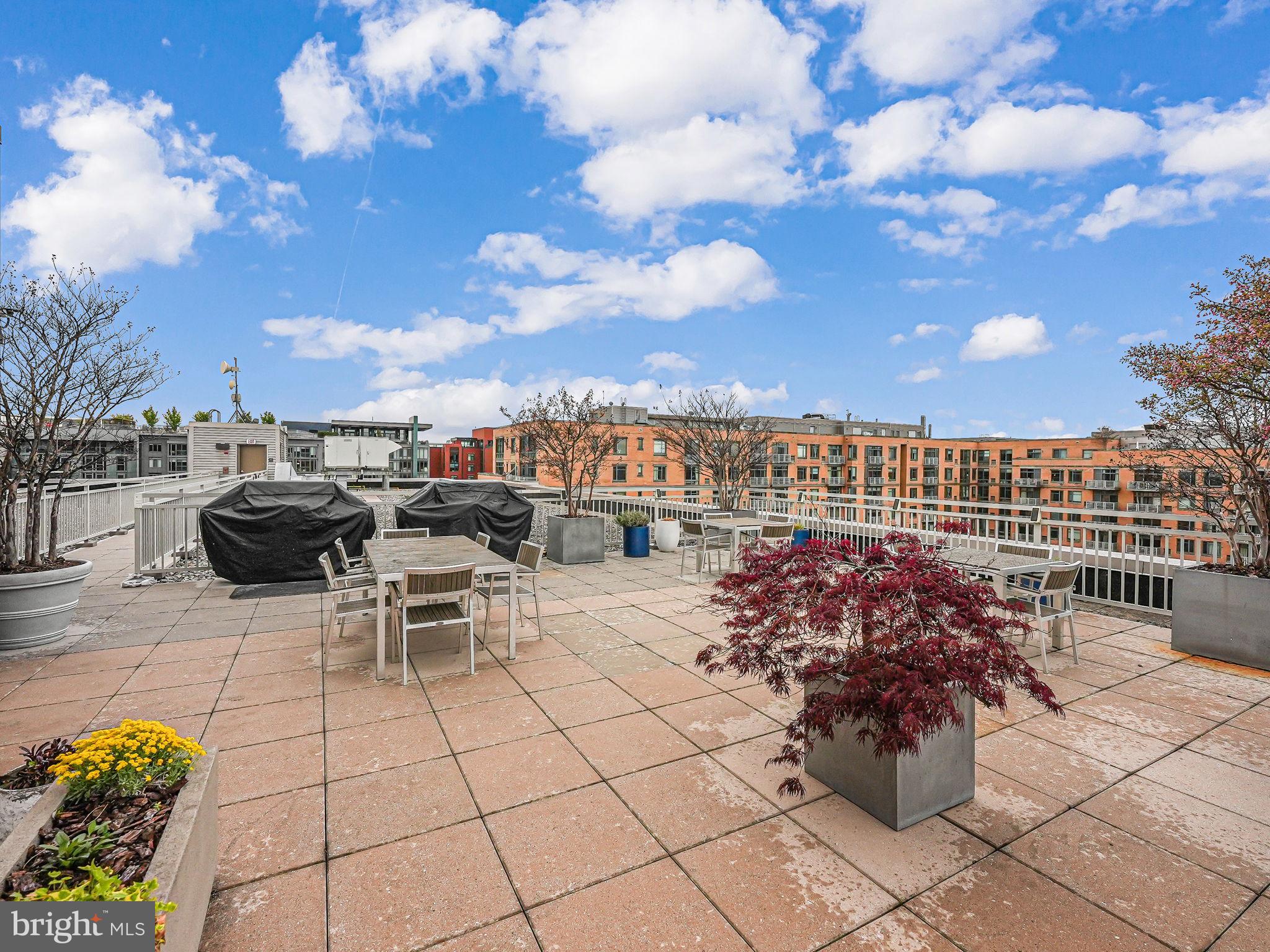 440 L Street Northwest, Unit 809 Washington, DC 20001 - Photo 38 of 50 a view of a terrace with furniture and city view