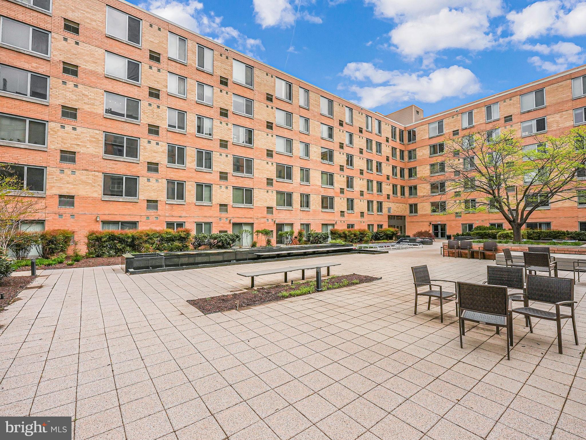 440 L Street Northwest, Unit 809 Washington, DC 20001 - Photo 41 of 50 a swimming pool with outdoor seating and yard