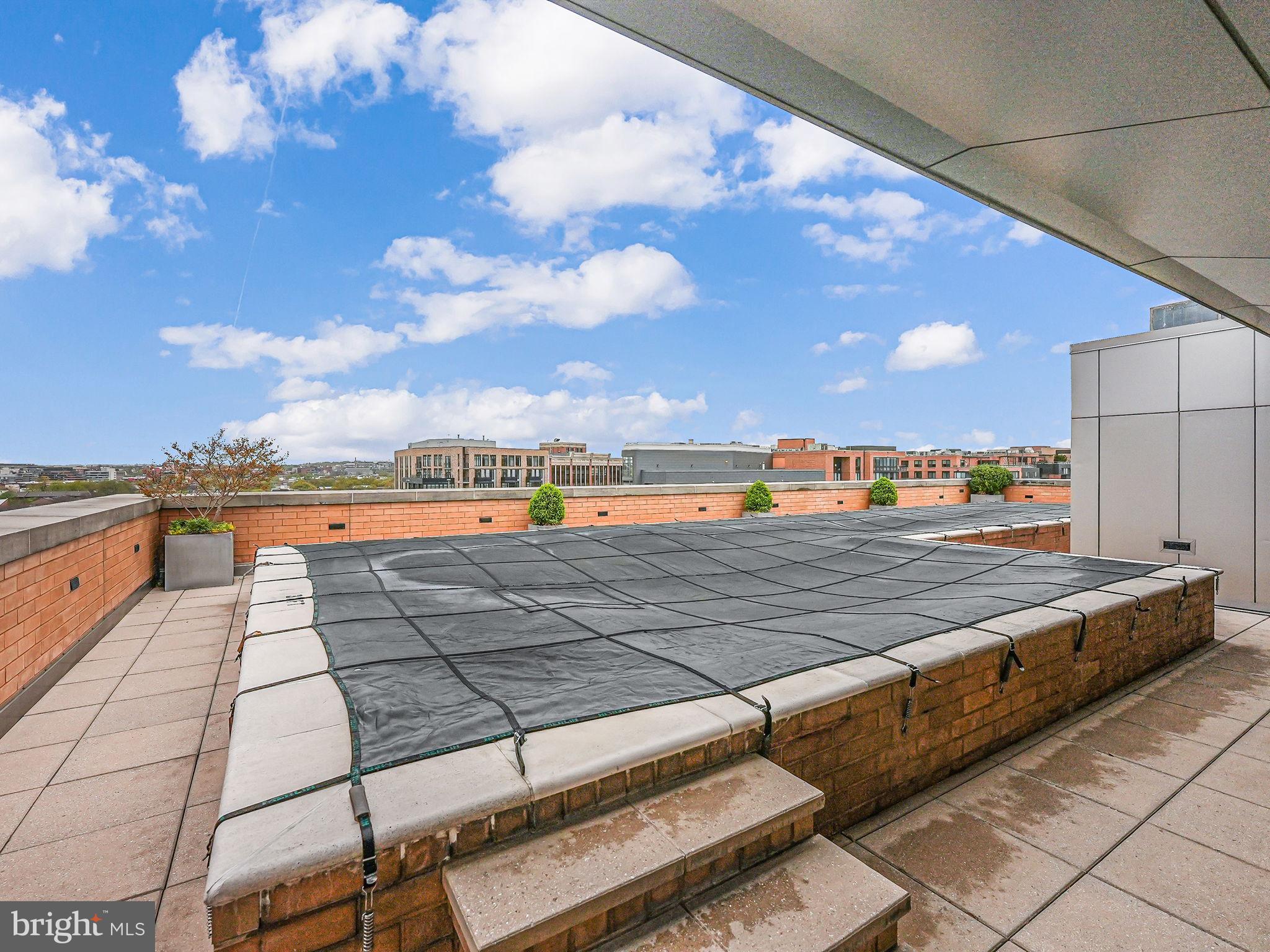 440 L Street Northwest, Unit 809 Washington, DC 20001 - Photo 44 of 50 a view of a terrace with wooden benches