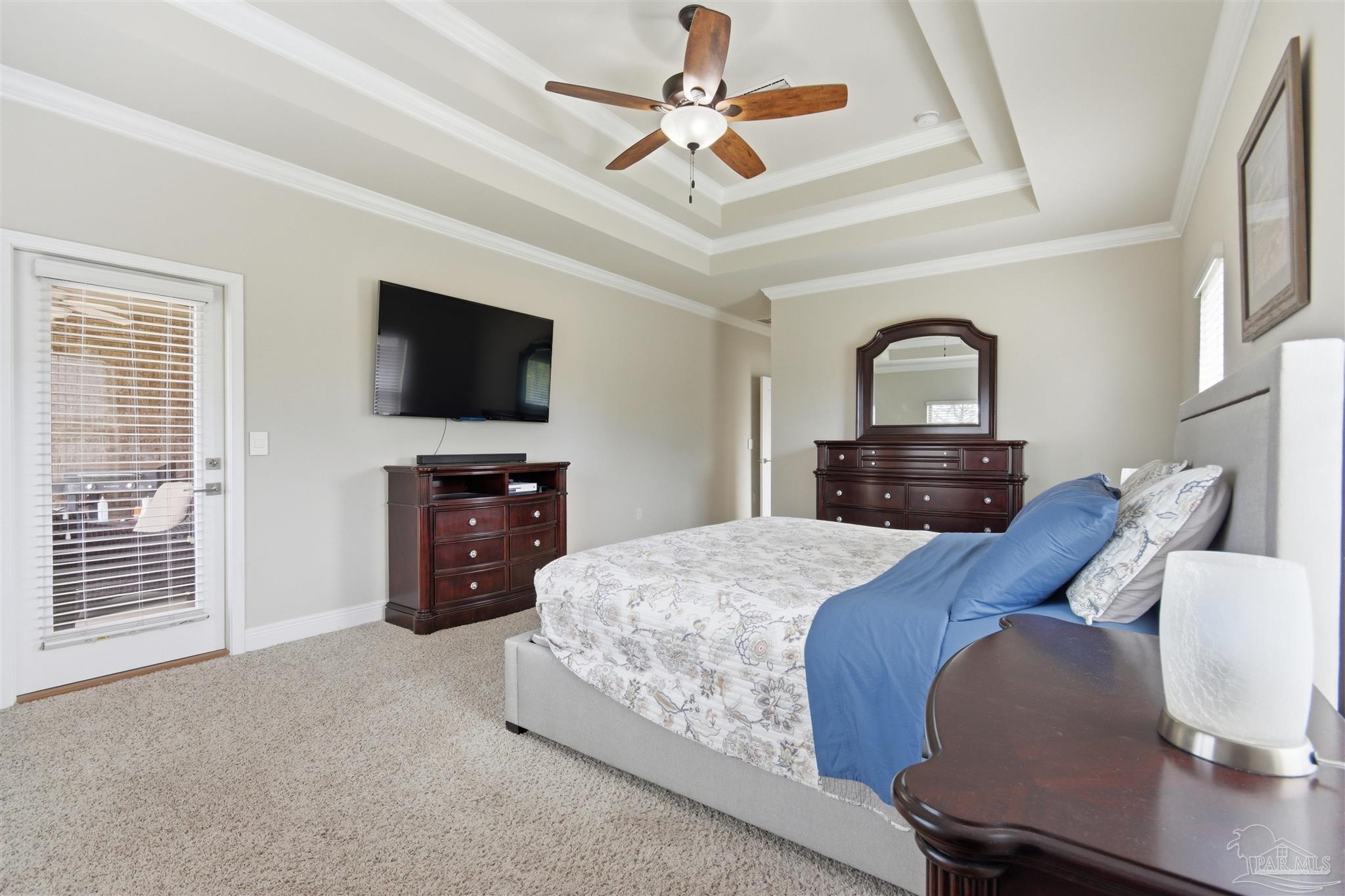 2677 Tulip Hill Road Pace, FL 32571 - Photo 19 of 35 a bed room with a bed a television and dresser