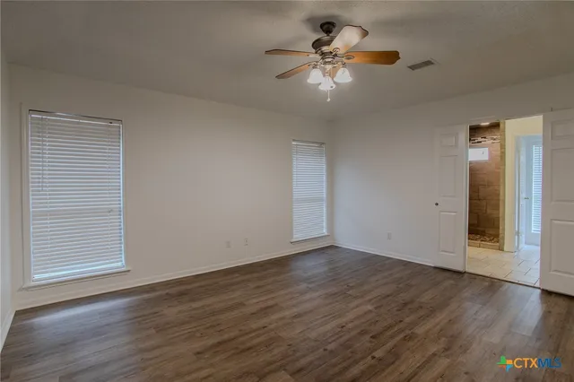 a bathroom with a sink double vanity and a mirror