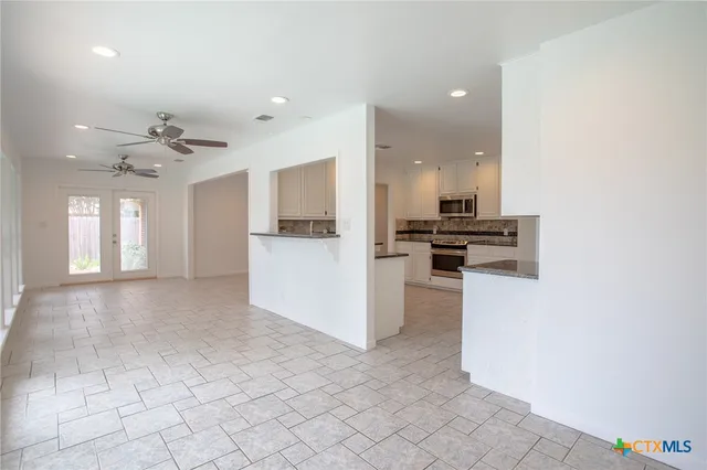 a view of a swimming pool with a sitting area