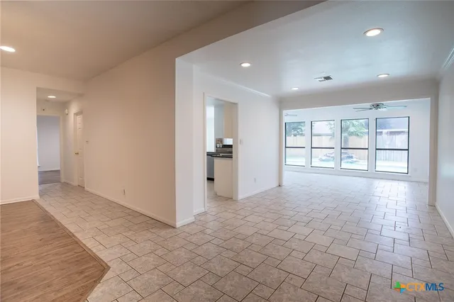 a view of an empty room with a window