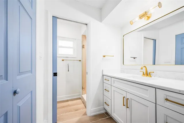 a bathroom with a sink and a mirror