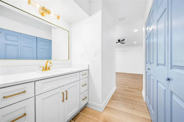 a hallway view with wooden floor