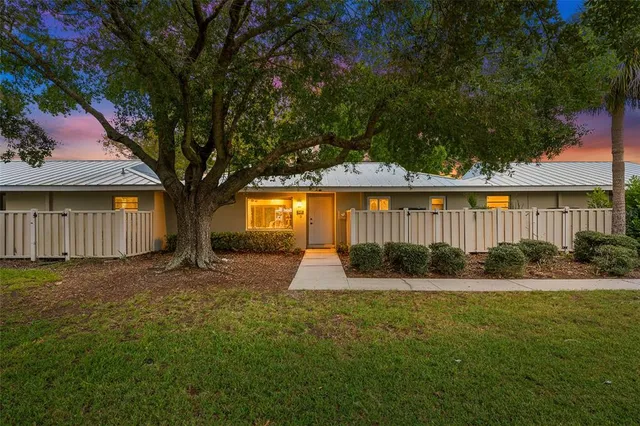 a swimming pool with outdoor seating and yard