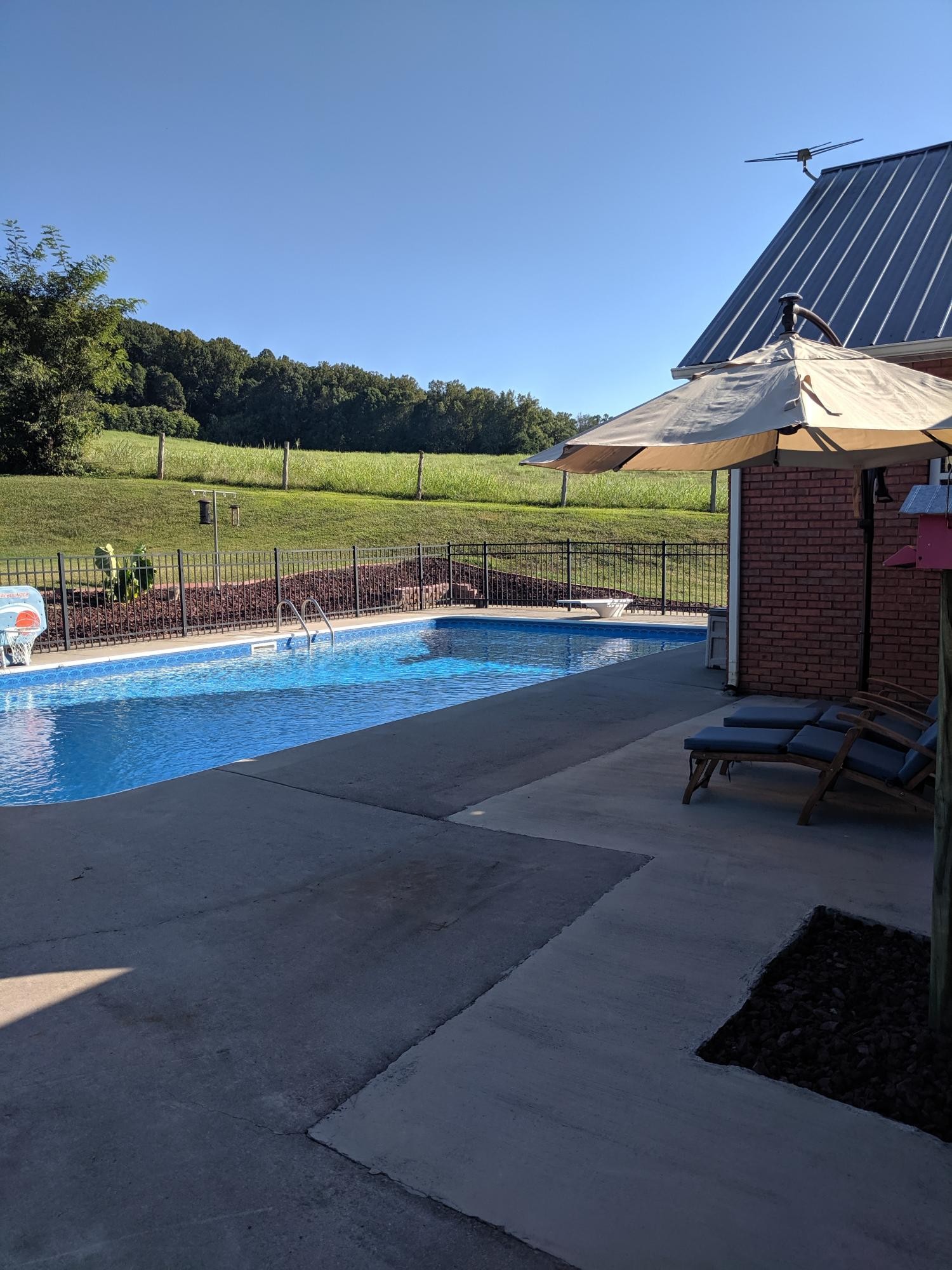 3691 Stockton Valley Road Loudon, TN 37774 - Photo 14 of 38 a view of a lake with a floor to ceiling window next to a yard