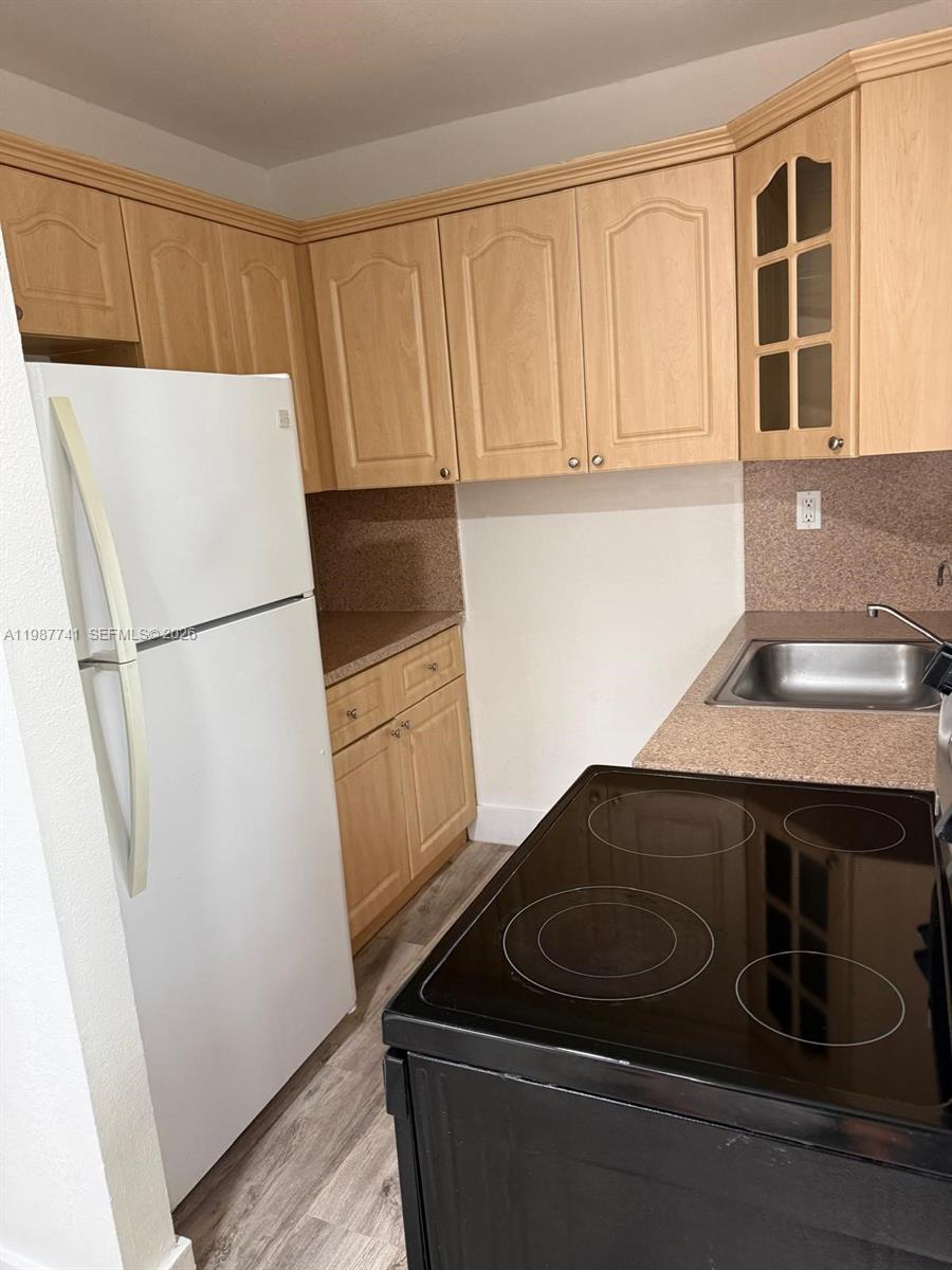 1467 Southwest 3rd Street, Unit 2 Miami, FL 33135 - Photo 13 of 14 a kitchen with a sink and a refrigerator