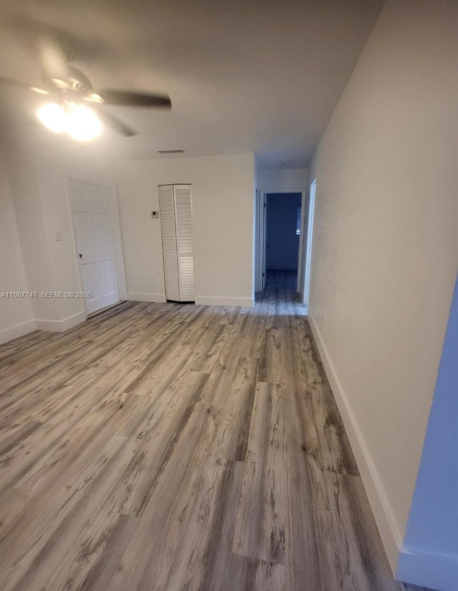 1467 Southwest 3rd Street, Unit 2 Miami, FL 33135 - Photo 9 of 14 a view of a room with wooden floor and a sink