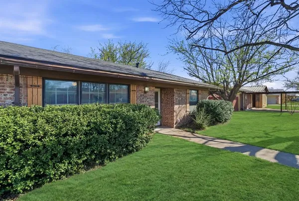 a view of a house with a garden