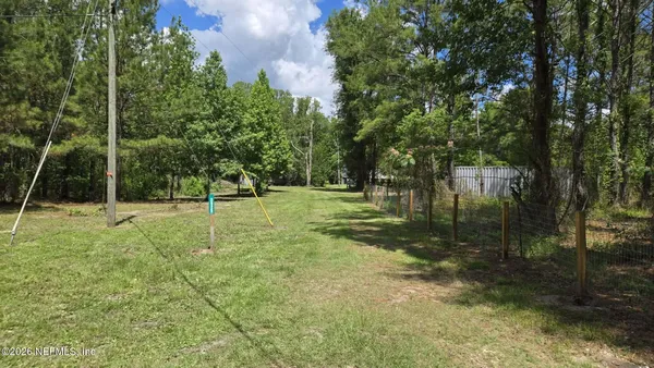 a view of outdoor space with trees all around