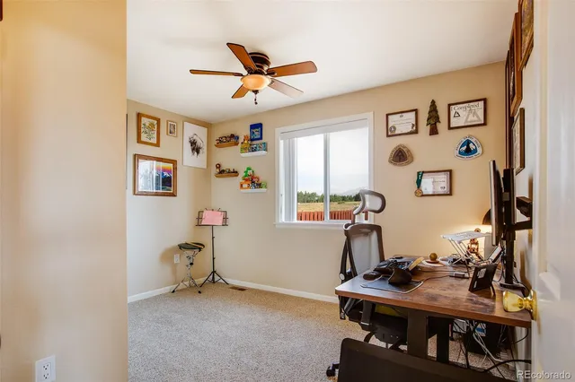 a workspace with furniture and window
