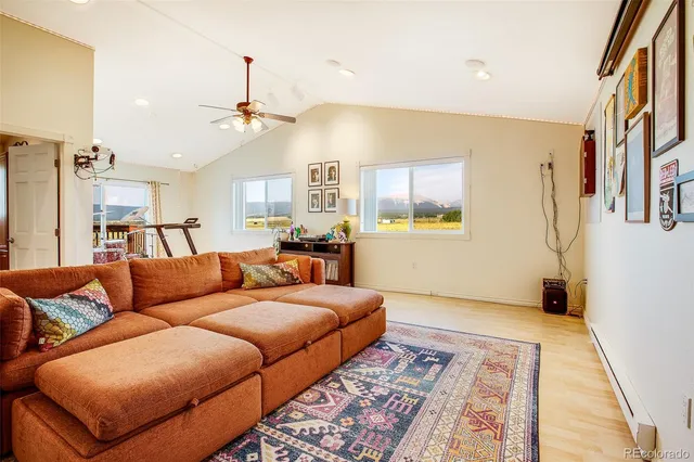 a living room with furniture and a rug
