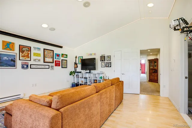 a view of walk in closet with clothes