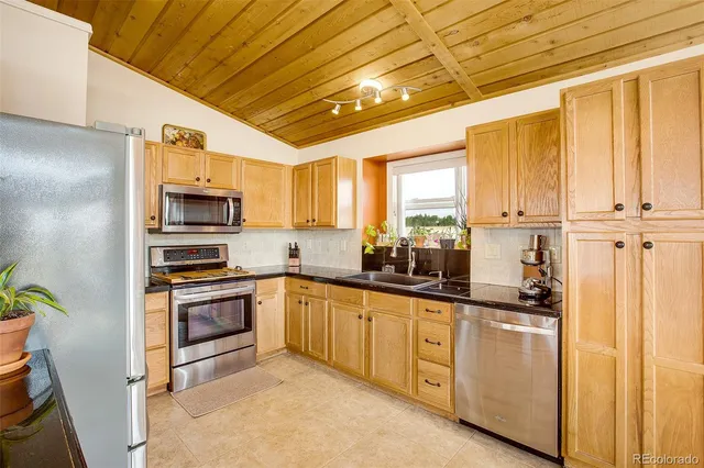 a front view of house with yard and swimming pool