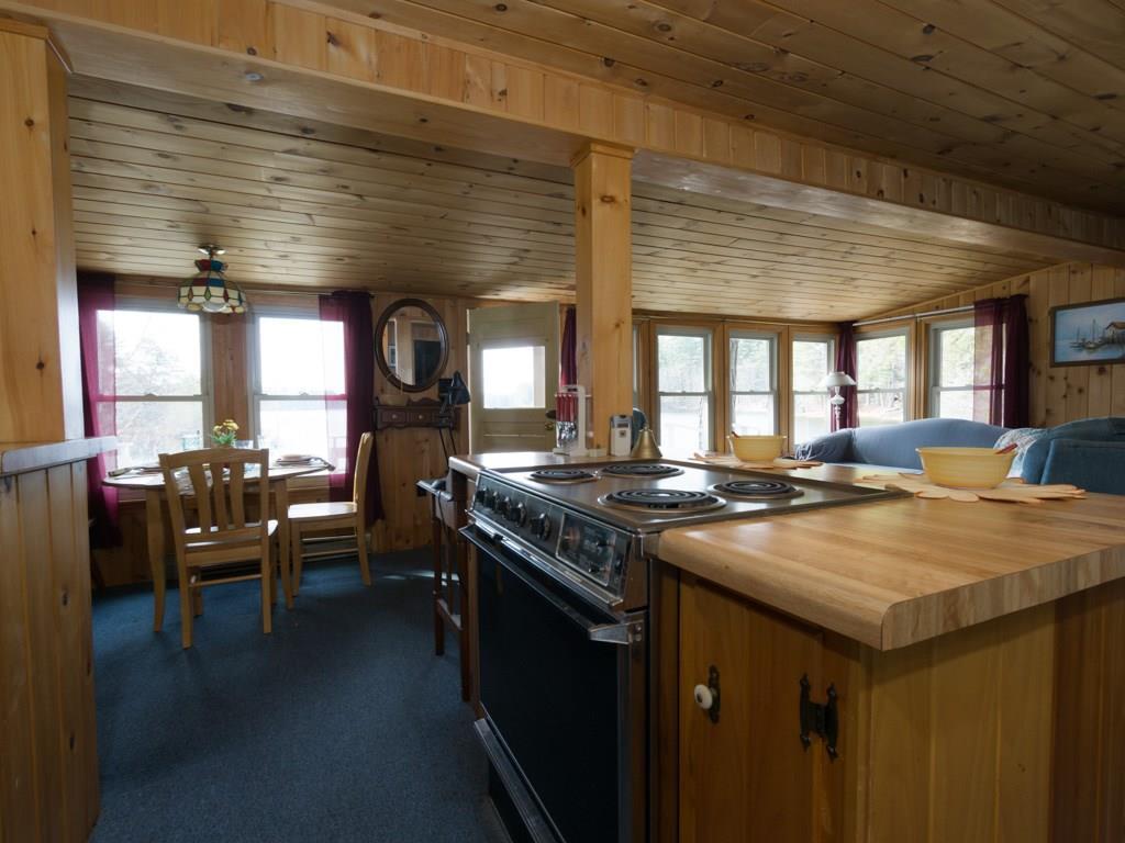 19 June Street Limington, ME 04049 - Photo 10 of 32 A multitude of windows in the main...