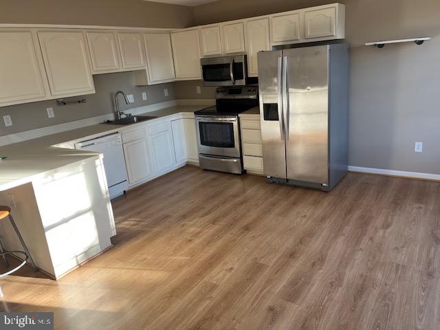 1642 Hilltop Road Edgewater, MD 21037 - Photo 2 of 10 a kitchen with stainless steel appliances a refrigerator sink and microwave