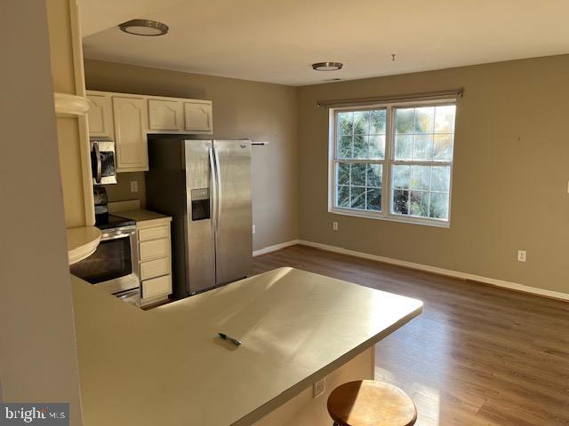 1642 Hilltop Road Edgewater, MD 21037 - Photo 3 of 10 a kitchen with stainless steel appliances a refrigerator and a counter top space