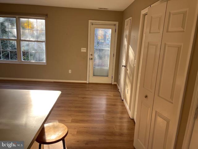 1642 Hilltop Road Edgewater, MD 21037 - Photo 4 of 10 a view of a room with wooden floor and chair