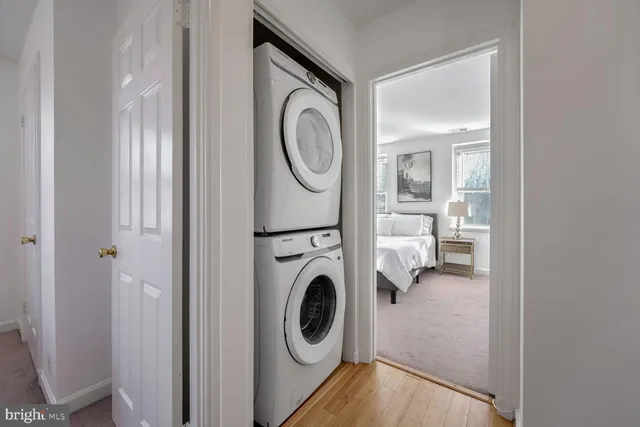 a view of a hallway with washer and dryer