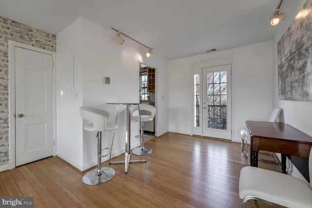 a view of a livingroom with furniture and a window
