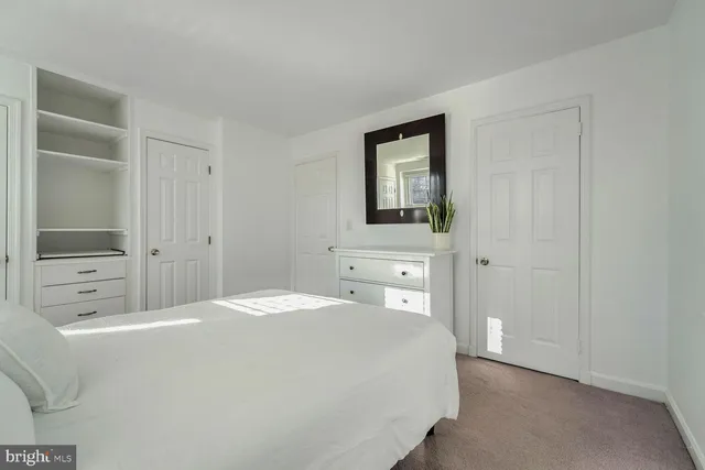 a bedroom with a bed and a view of bathroom