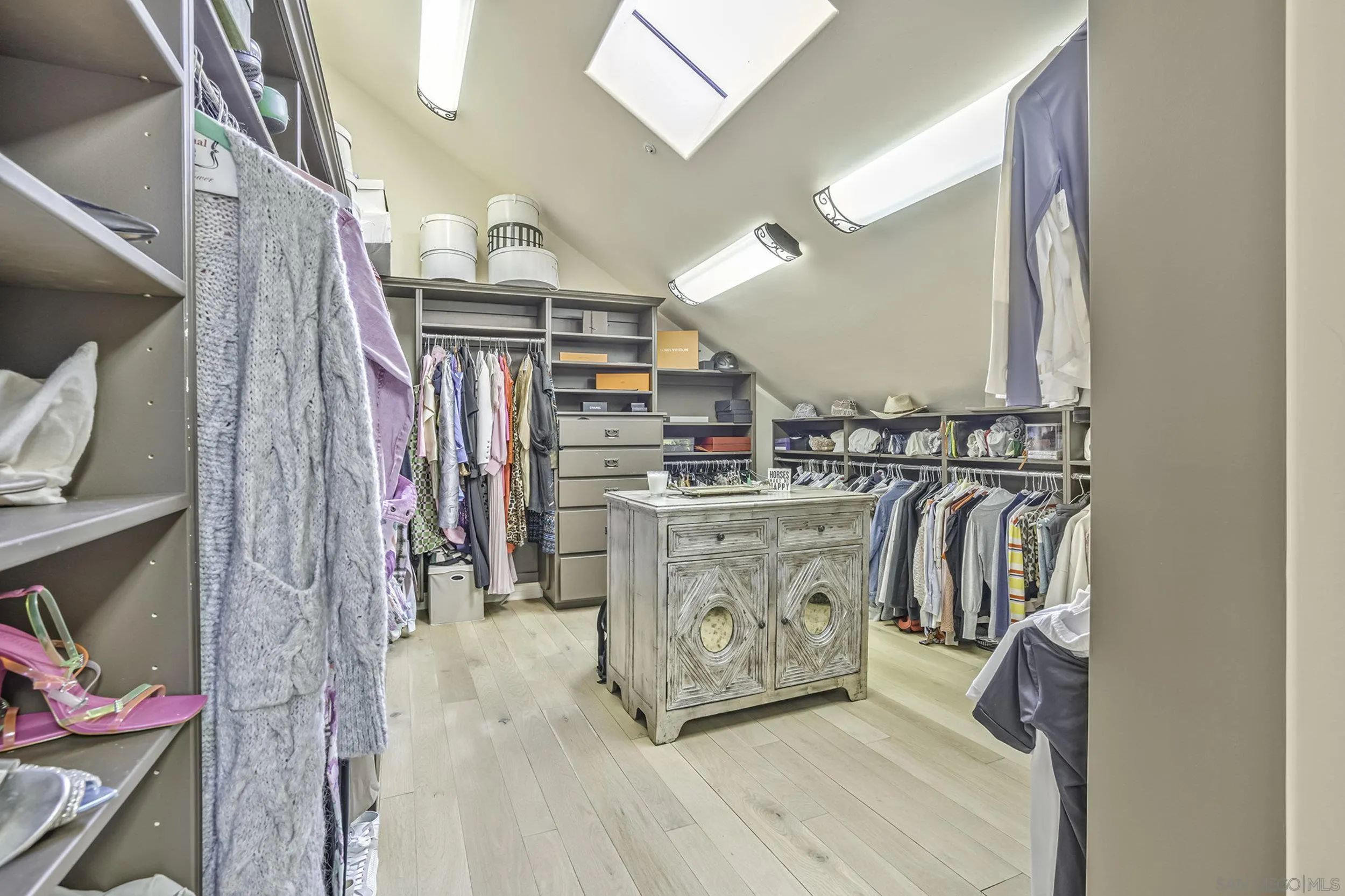 5305 La Crescenta Road Rancho Santa Fe, CA 92067 - Photo 45 of 63 2 parts of the primary walk in closet , to house the largest of wardrobes.
