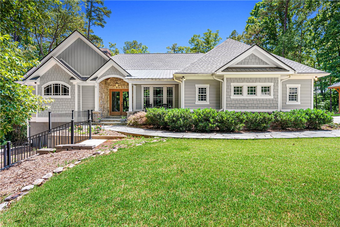 285 Bertha Allen Road Westminster, SC 29693 - Photo 6 of 50 Crafted with board and batten siding, this elegant home presents a stone entry and an inviting front walkway.