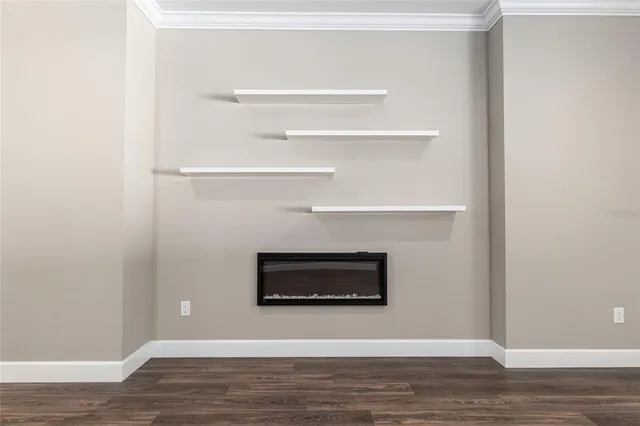 a kitchen with stainless steel appliances granite countertop a sink a stove a refrigerator with wooden floors