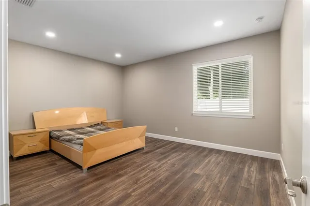 a bedroom with a bed and cabinets